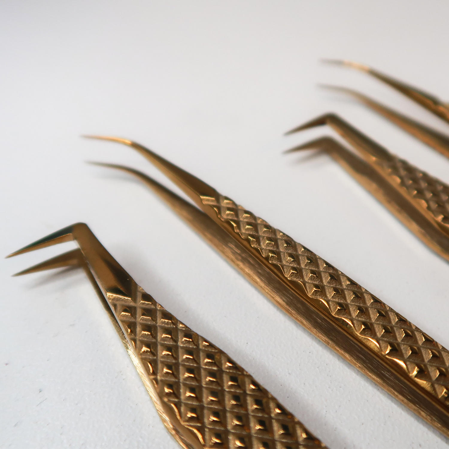 Set of gold lash tweezers